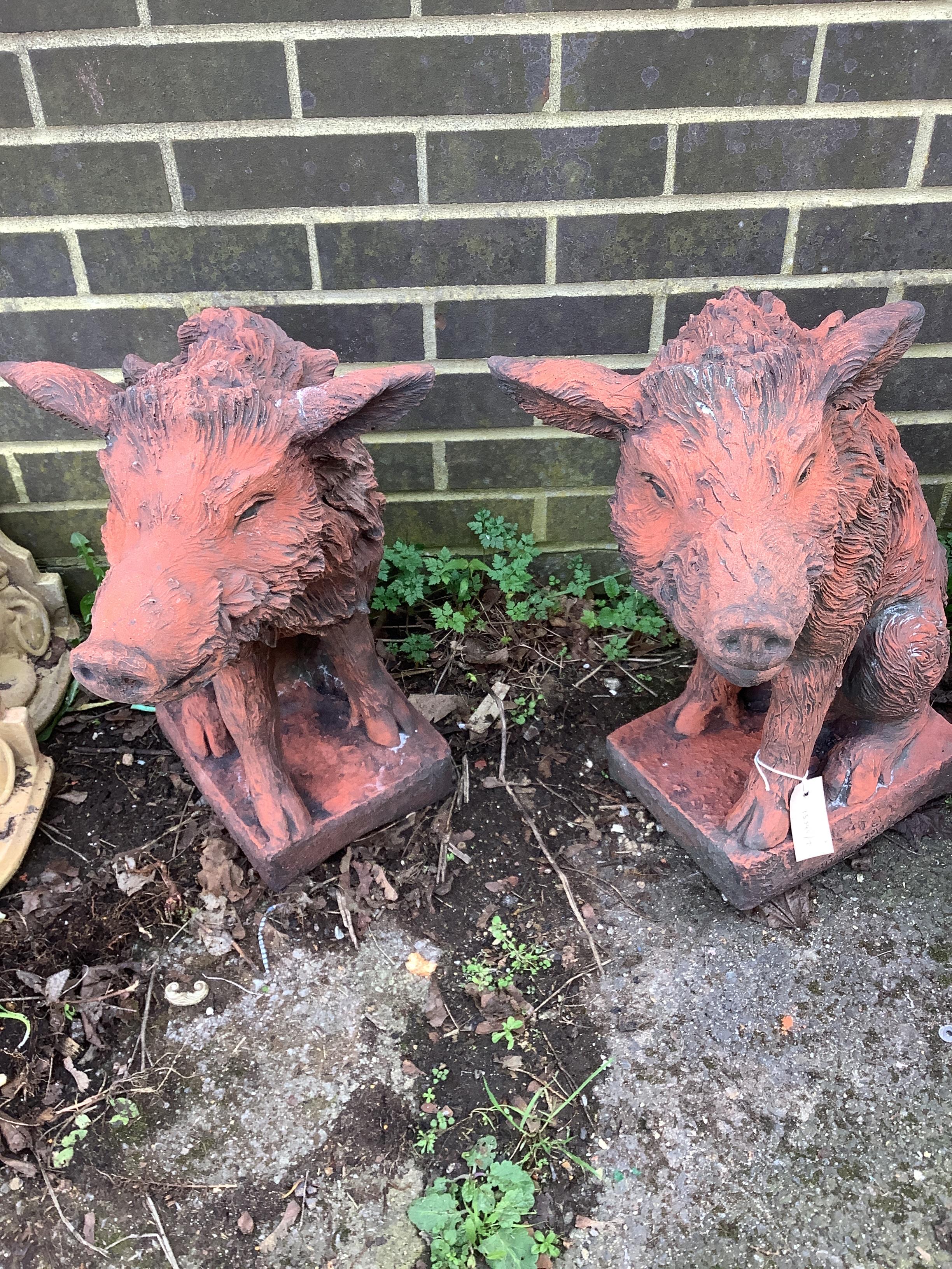 A pair of terracotta wild boar garden ornaments, height 56cm